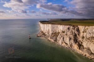 aerial drone photo of white cliffs and shoreline in south England